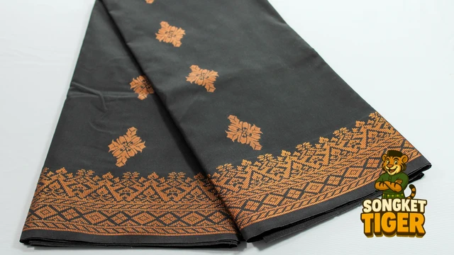 Kain Pasang Songket Tenun fabric design 6 by SongketTiger, folded to show its woven gold and silver motif border.