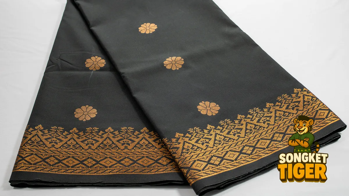 Songket fabric with metallic gold thread motif detail