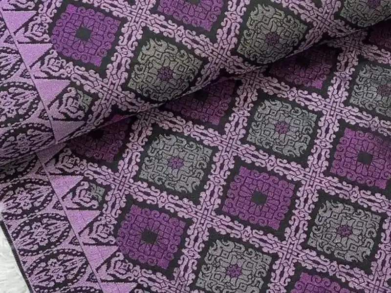Purple and grey Songket Tenun Penuh fabric with a full diamond-motif weave.